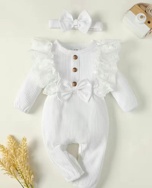 White frilly baby grow